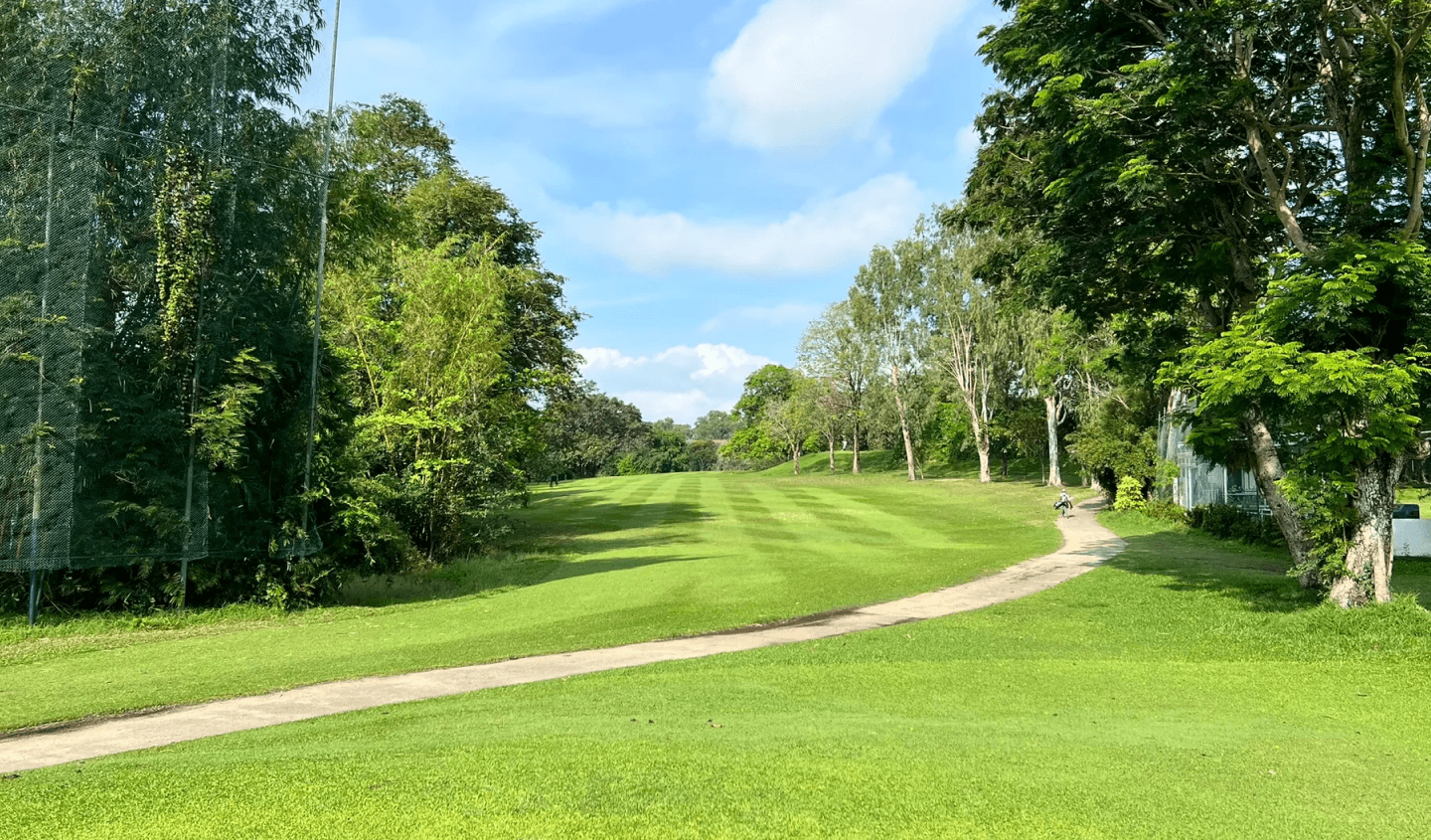 Golfer swinging on a beautiful golf course