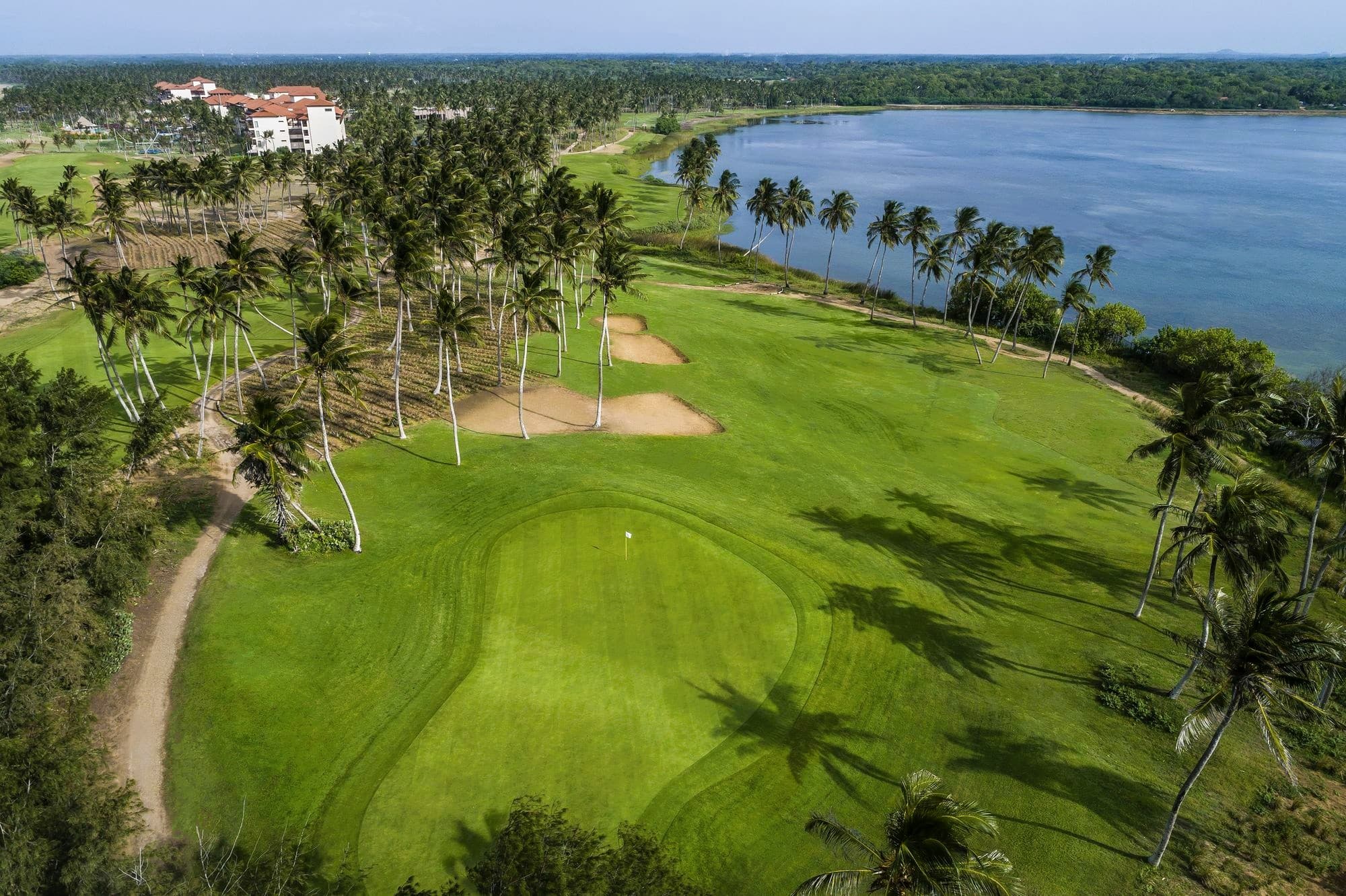 Golfer swinging on a beautiful golf course