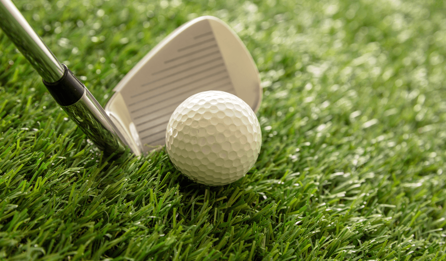 Golfer swinging on a beautiful golf course