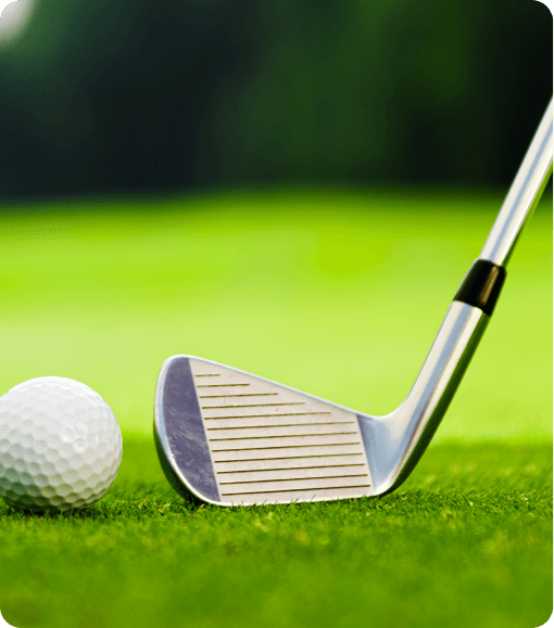 Golf instructor teaching students on a golf course